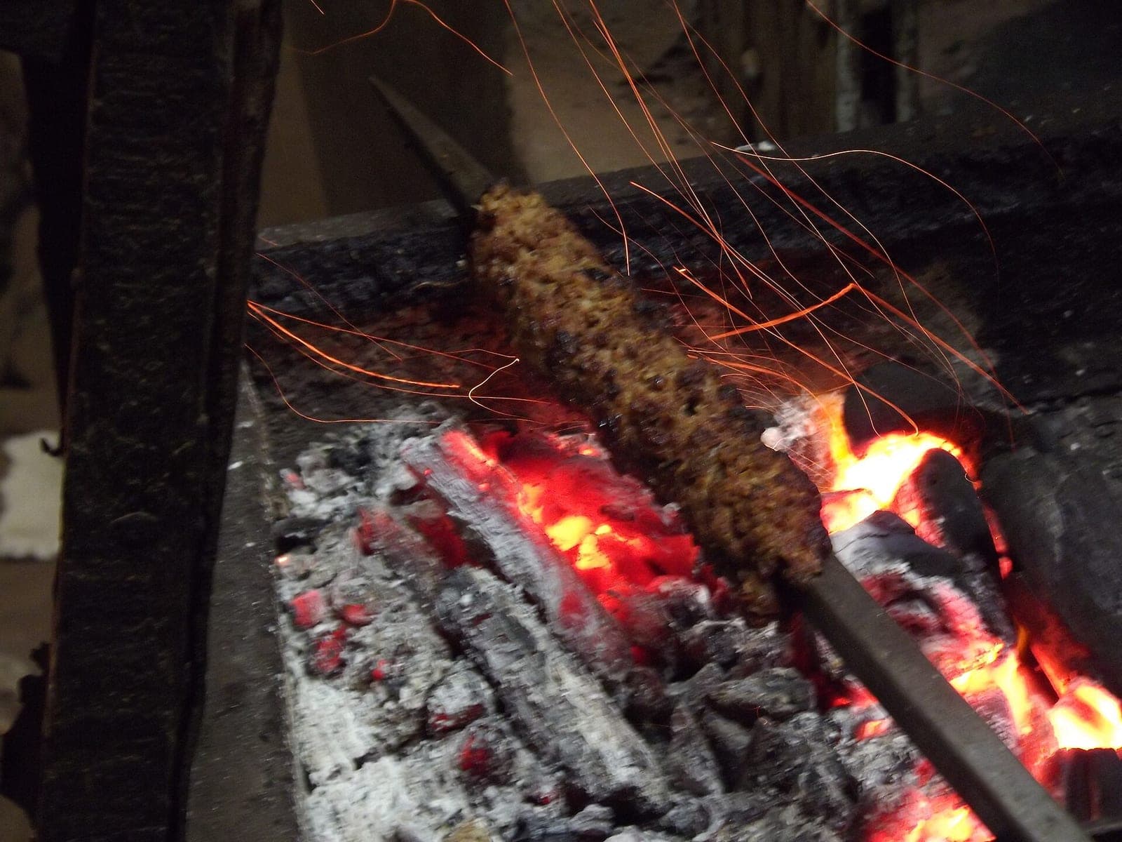 Kebabs grilling over live charcoal