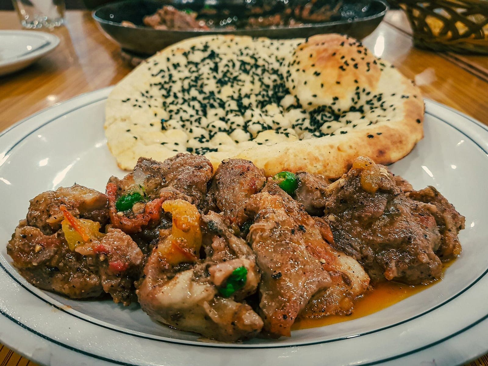 Karahi served with fresh sesame naan