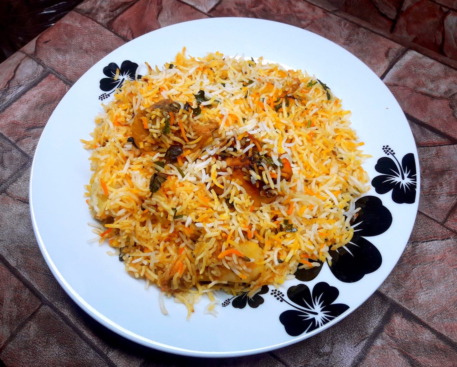 Fragrant biryani with saffron rice and tender meat