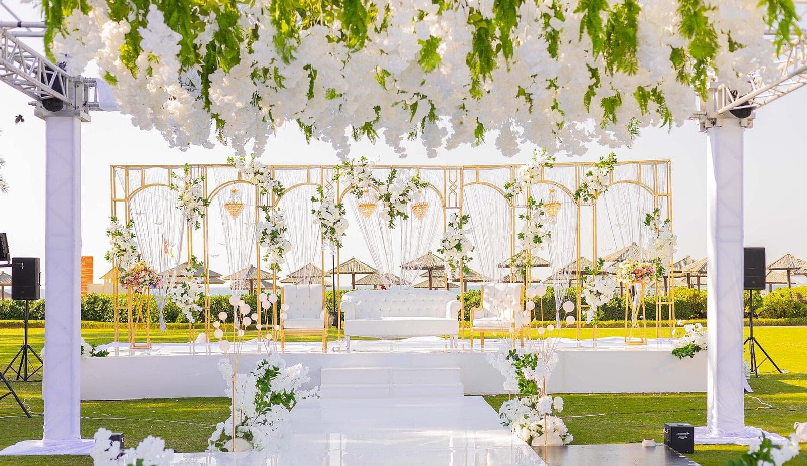 Wedding stage decorated with flowers and lights